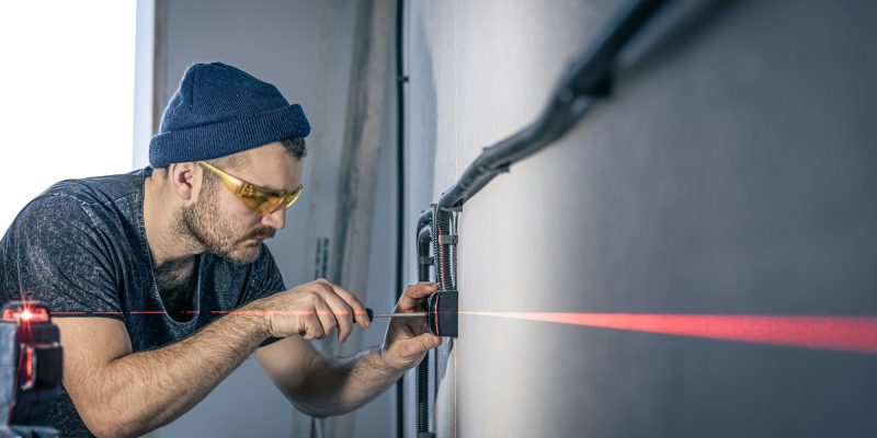 an-electrician-is-mounting-electric-sockets-on-the-9XDPN62